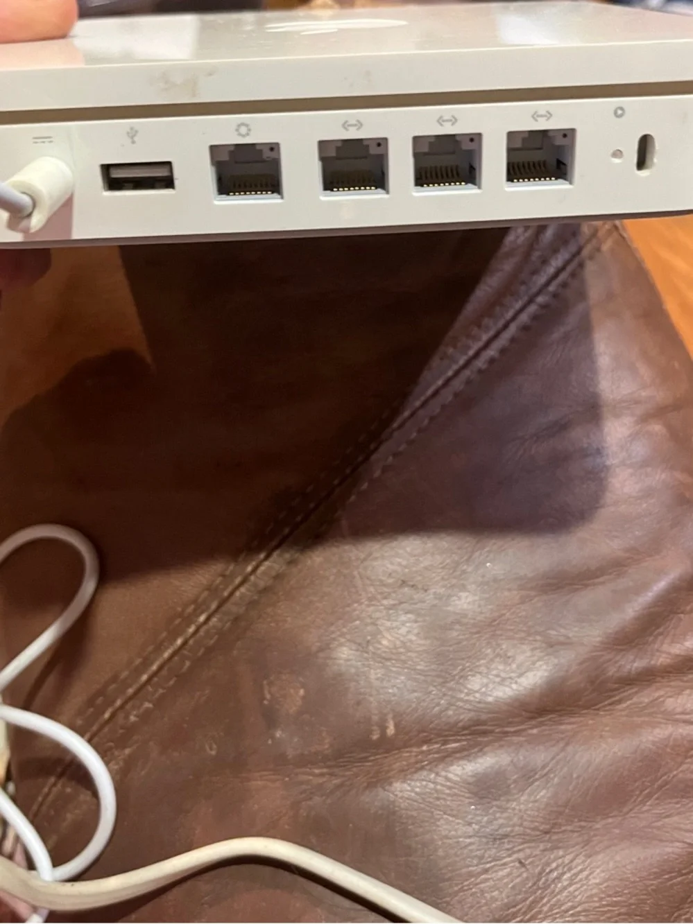 Apple AirPort Extreme base station with power supply.